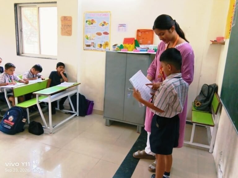 Grade 2 Science Teacher helping with phonics