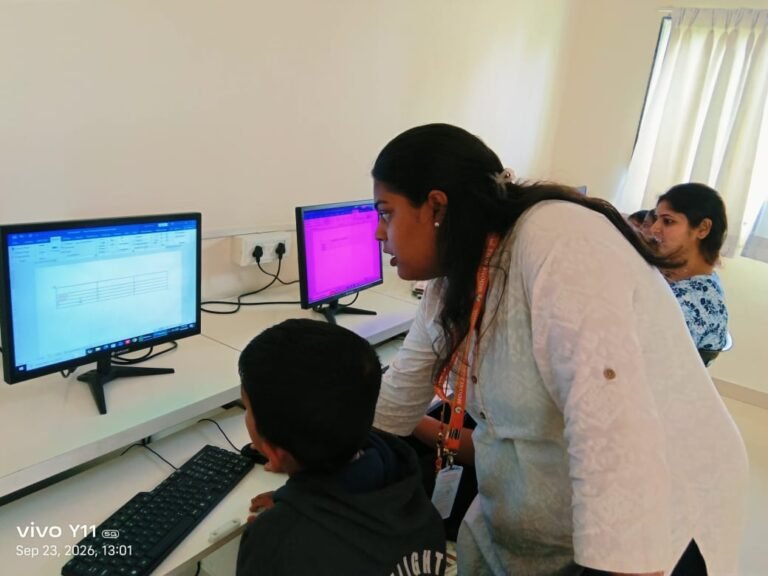 Grade 3 students learning with teacher basic ICT